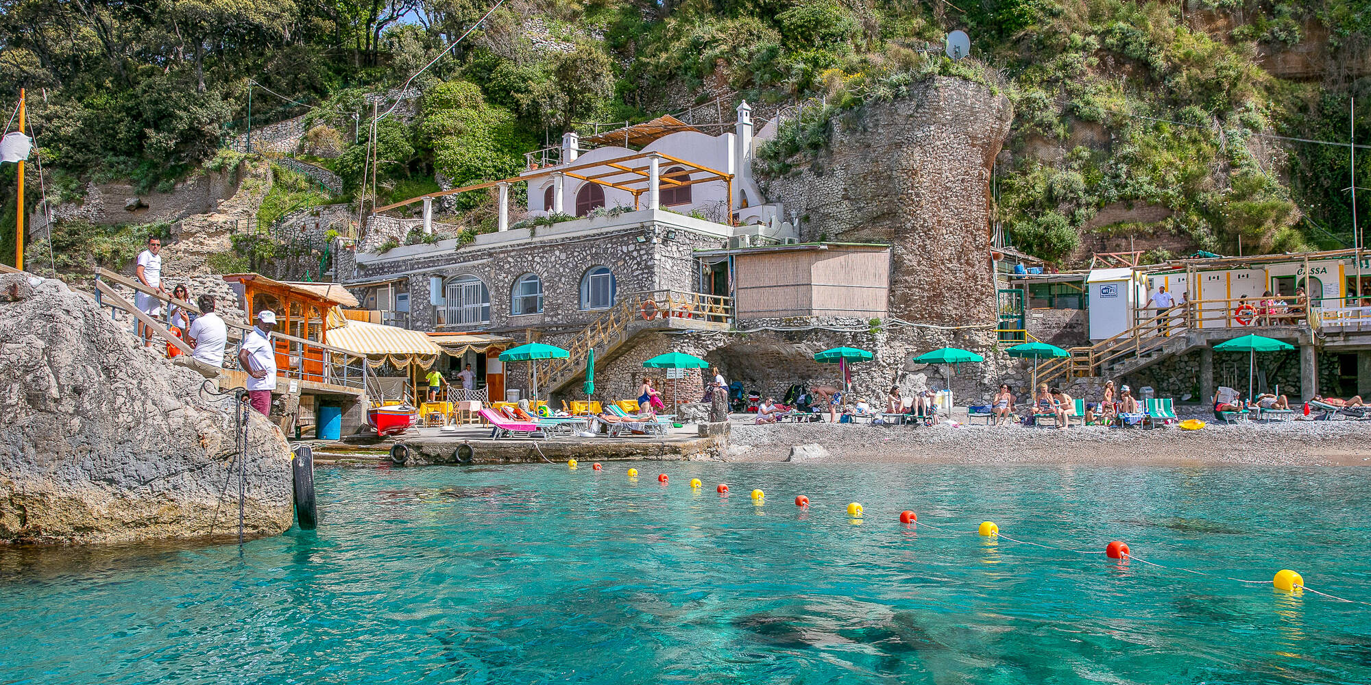 A beach club, restaurant, and boat<br>for the perfect day on Capri